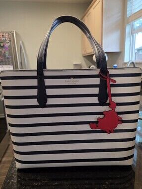 kate spade navy and white striped tote with red crab charm